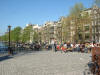Crowded outdoor cafe on a warm spring afternoon